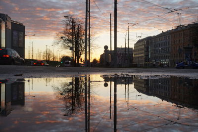 Reflection of buildings in puddle