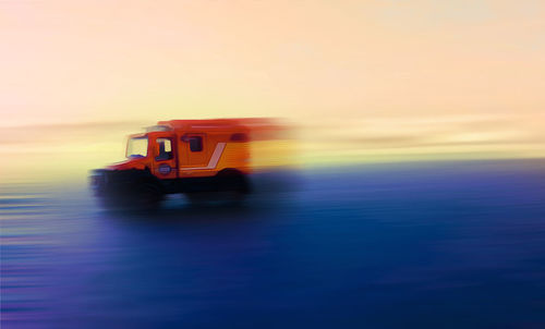 Boat on sea against sky during sunset