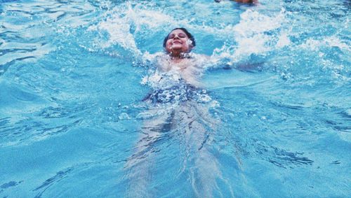 Woman swimming in pool