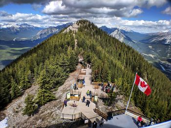 High angle view of trees and snowcapped mountains against sky