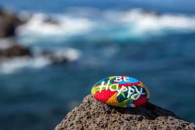 Close-up of multi colored rock on shore