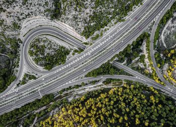 Aerial view of highway amidst forest