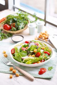 Salad in plate on table