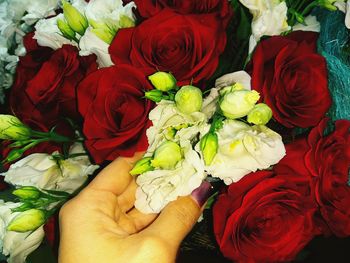 Midsection of person holding bouquet