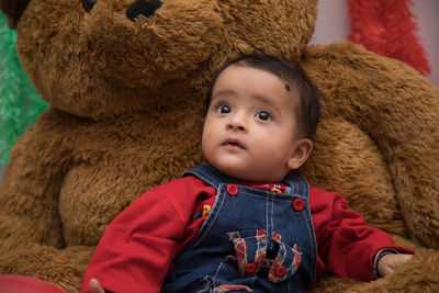 Portrait of cute baby boy looking away