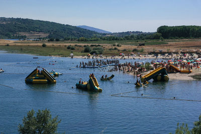 High angle view of people on river against sky