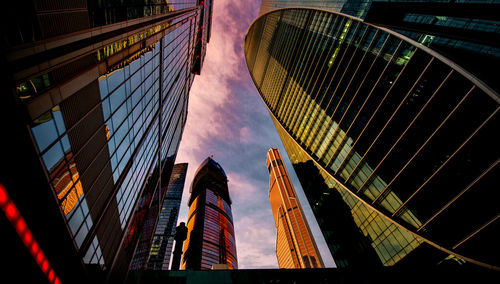 Exterior of modern buildings against sky during sunset