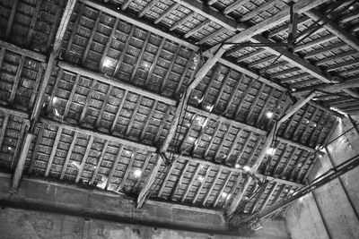 Low angle view of illuminated ceiling in old building