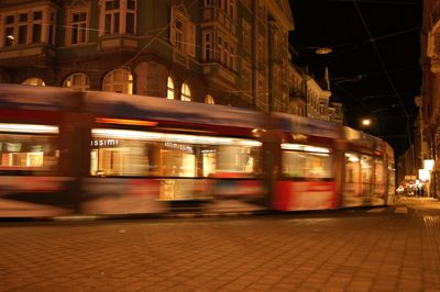 Blurred motion of car moving on road at night