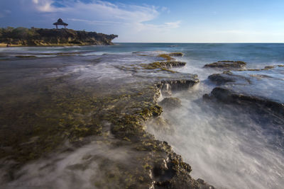 Scenic view of sea against clear blue sky