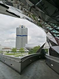 View of modern building against cloudy sky