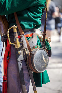 Midsection of man wearing costume