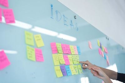 Woman working with text on wall