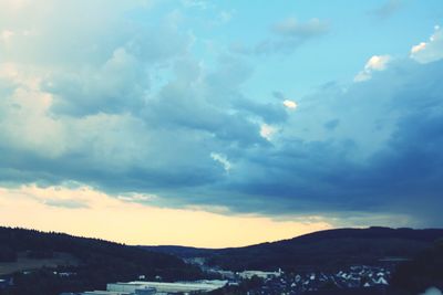 Scenic view of silhouette mountains against sky during sunset