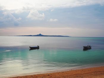 Boat sailing in sea against sky