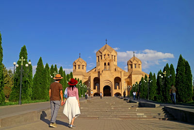 Couple being impressed with the yerevan cathedral in the central district of yerevan, armenia