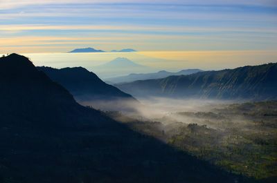 Scenic view of mountains against sky during sunset