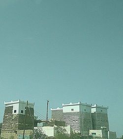 Low angle view of buildings against clear sky