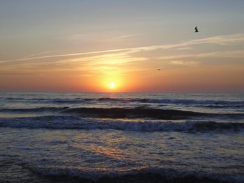 Scenic view of sea against sky during sunset