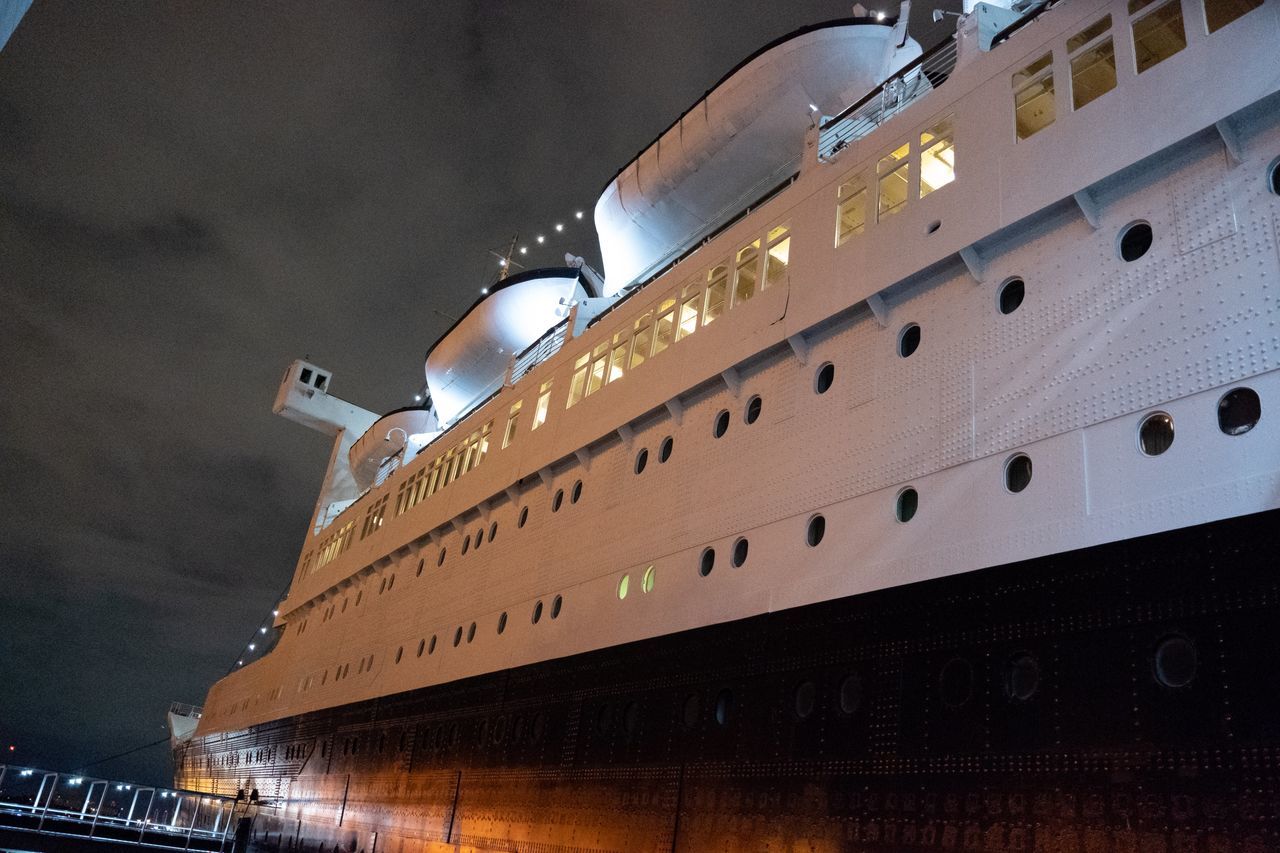 passenger ship, ocean liner, cruise ship, ship, architecture, vehicle, night, watercraft, transportation, built structure, no people, illuminated, building exterior, sky, mode of transportation, reflection, low angle view, freight transport, boat, light, nature, naval architecture