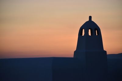 Close-up of silhouette structure against sky during sunset