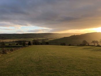 Scenic view of landscape against sky during sunset