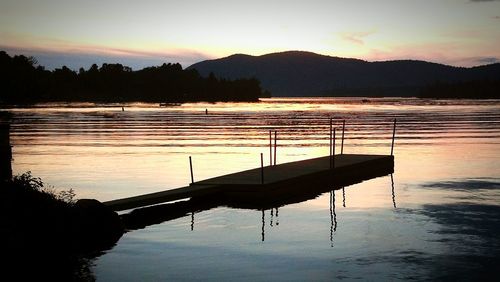 Scenic view of lake at sunset