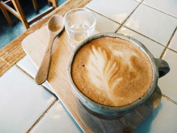 High angle view of coffee on cutting board