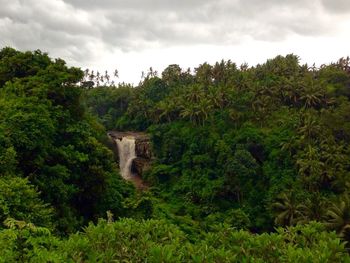 Scenic view of landscape against cloudy sky