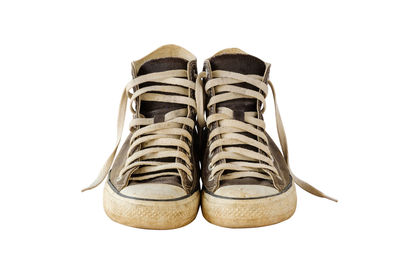 Close-up of shoes against white background