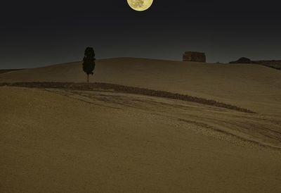 Scenic view of desert against sky at night