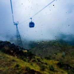 Raindrops on glass window during rainy season