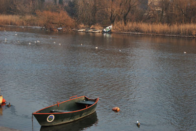 Boats moored in lake