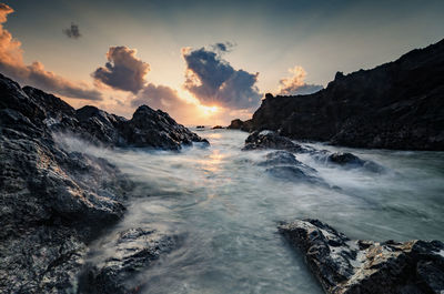 Scenic view of sea against sky at sunset