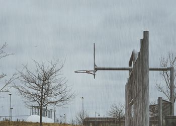 Low angle view of basketball hoop during rainy season