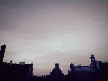 High section of building against sky at sunset