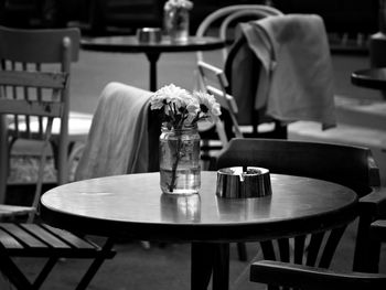 Empty chairs and tables at an outdoor restaurant