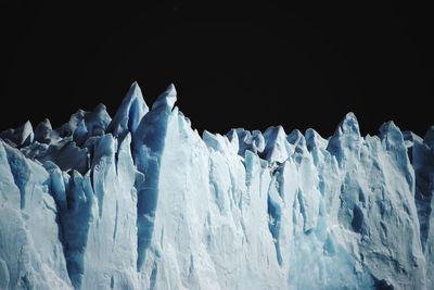 Panoramic view of frozen landscape against sky