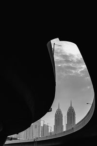 Buildings against cloudy sky