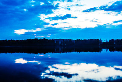 Reflection of clouds in calm lake