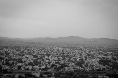 Aerial view of townscape against sky