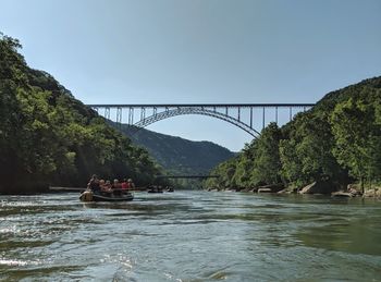Scenic view of bridge over river against sky