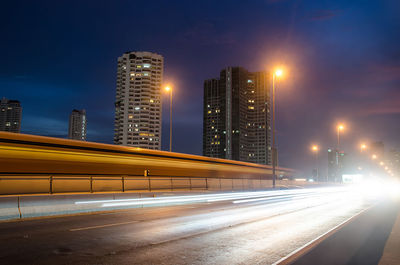 Light trails on city street at night