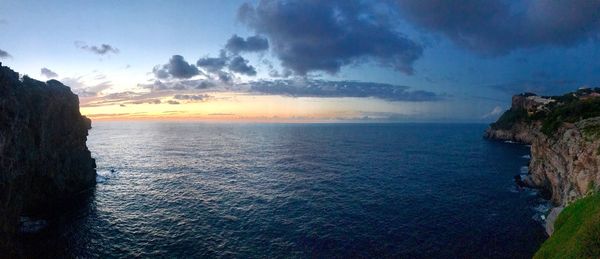 Scenic view of sea against sky at sunset