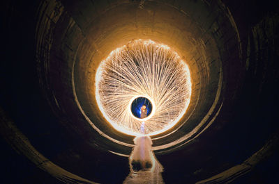 Low angle view of illuminated tunnel