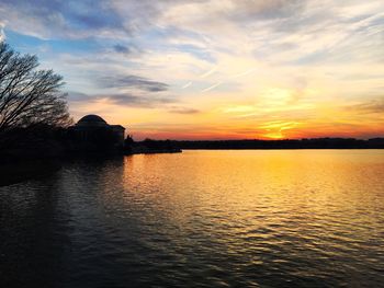 Scenic view of lake against sky during sunset