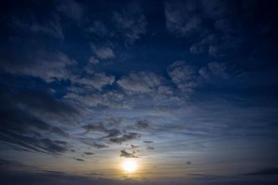 Low angle view of cloudy sky at sunset