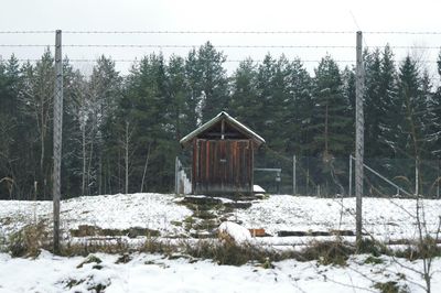 House on snow covered field