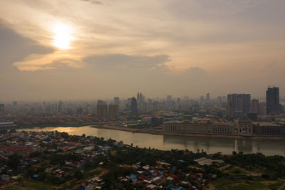 High angle view of buildings against sky during sunset