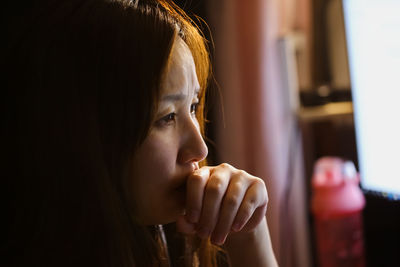 Portrait of young woman looking away